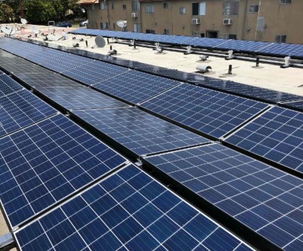 Commercial solar array installed on a flat rooftop